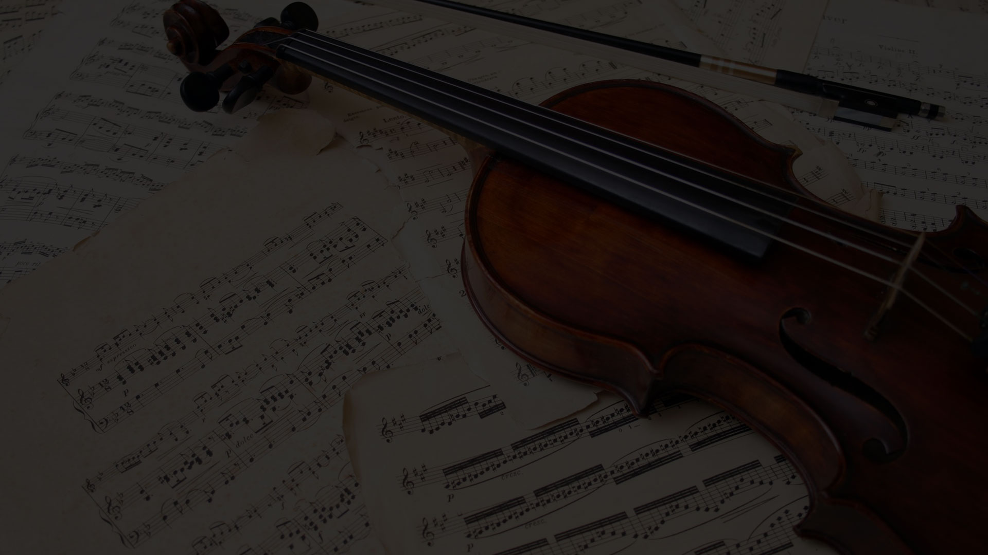 A violin resting on sheet music